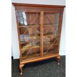 Antique two door glass section book case. supported on queen anne legs. [183x130x45cm]