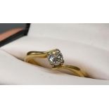 A Ladies 18ct gold and single diamond ring. 0.25ct diamond. [Ring size K] [2.76Grams]