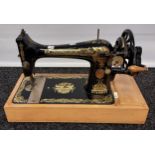 A Vintage Singer sewing machine. Showing Egyptian graphics to the body