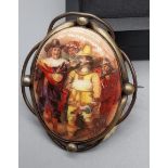 A 19th century ceramic and gilt metal brooch depicting musketeers. [6x5cm]