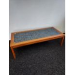A Danish 70's blue tiled top coffee table in the style of David Rosen for Nordiska. [40x140x63cm]