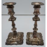 A Pair of ornate Birmingham silver candlesticks, produced by Barker Ellis Silver Co and dated