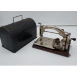 A Vintage Ideal British made sewing machine with metal carry case.