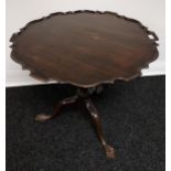 A Georgian/ Victorian drop end parlour table. Designed with pie crust edge and ball and claw feet
