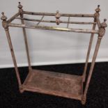 An Antique brass painted stick stand.