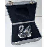 A Giant Swarovski Swan paperweight. Comes with a travel case and outer packing box.