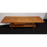A Mid century two tier coffee table. Designed with a single pull drawer. [43.5x136x40cm]