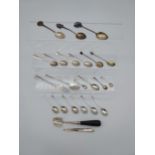 A Large selection of silver hall marked tea spoons, souvenir spoons, Mother of pearl fruit knife etc