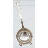 A Sheffield silver tea strainer produced by Walker & Hall. [50.83grams] [15cm in length]