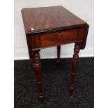 A 19th century drop leaf table with single centre drawer, raised on turned supports [74x74x46cm]