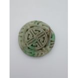 A Chinese hardstone Ming style Bi/ Disc carved with a dragon. [5.5cm in diameter]