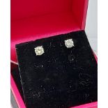 A pair of 14ct white gold diamond stud earrings [50] [0.61g]