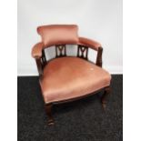 19th century parlour tub chair, with three centre splats, supported on cabriole legs with brass