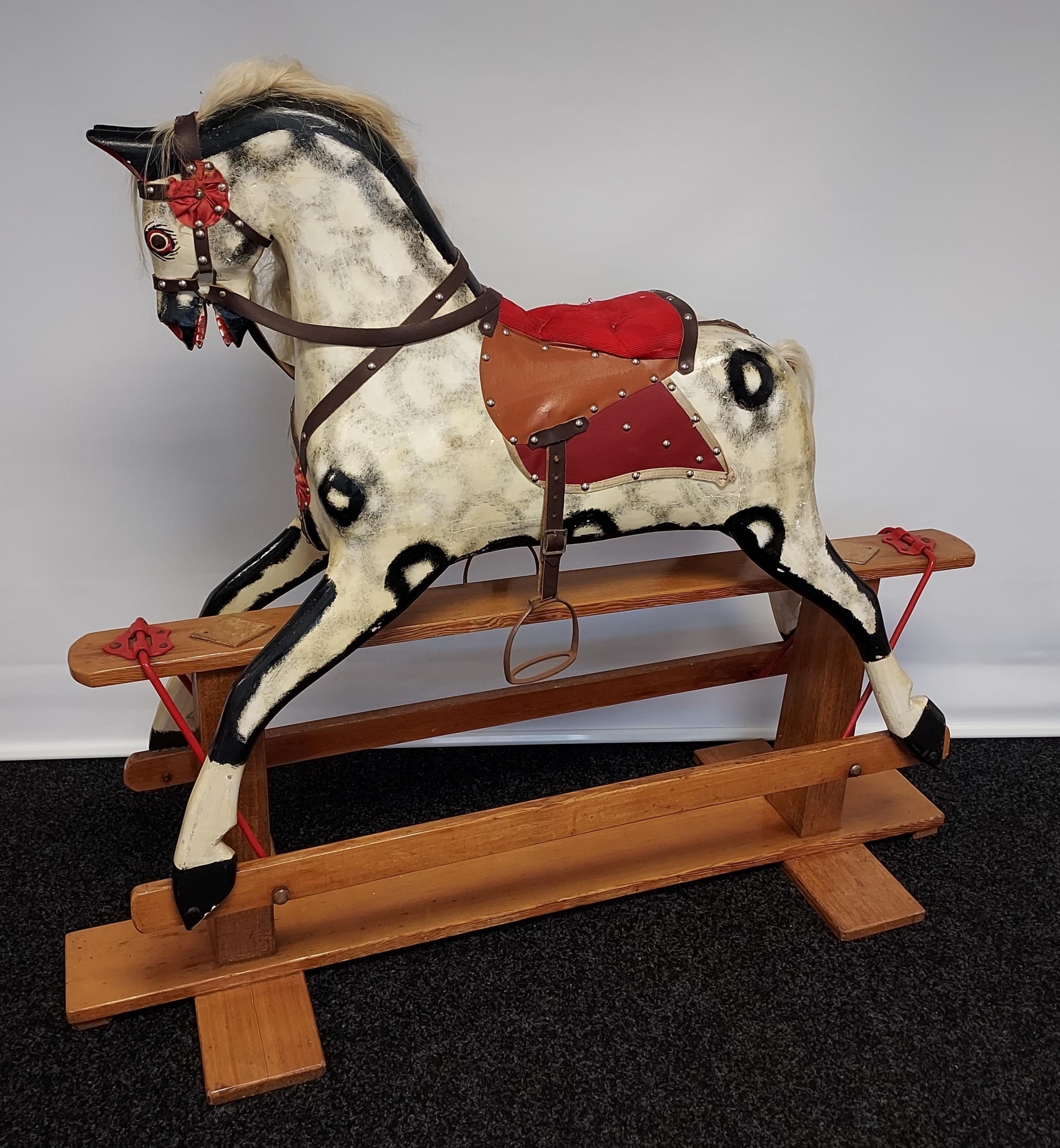 A 19th century wood and hand painted rocking horse, fitted with horse hair main and tail. [118cm
