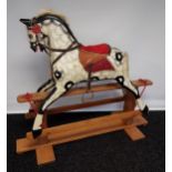 A 19th century wood and hand painted rocking horse, fitted with horse hair main and tail. [118cm