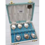 A Set of London silver golf tea spoons with a fitted box.