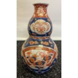 A Japanese imari pattern bulbous vase. [Chip to rim] [26cm]