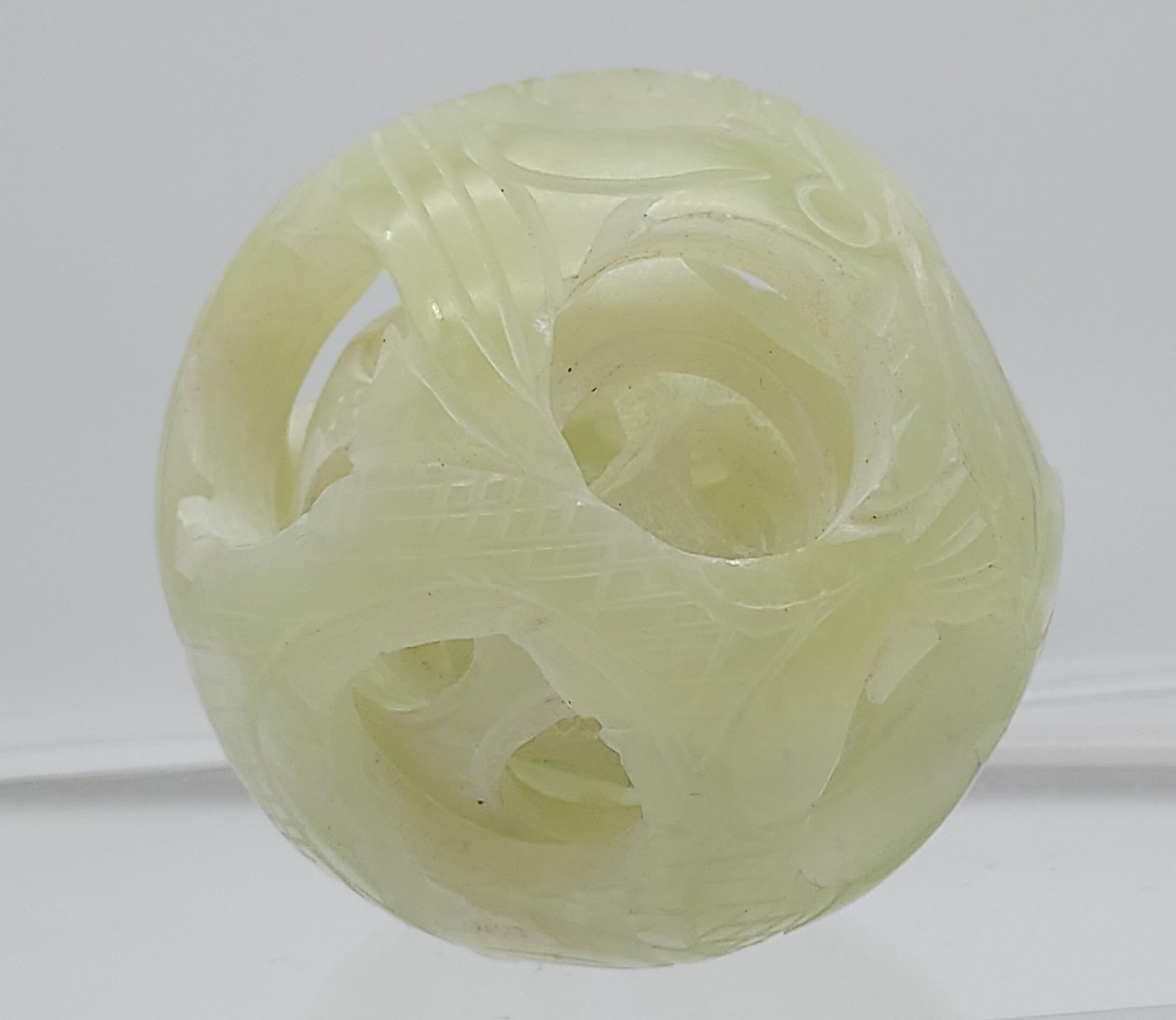 Antique early 20th century Chinese hand carved jade puzzle ball sculpture. [5cm in diameter]
