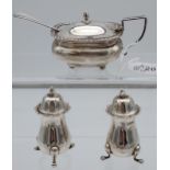 A Set of three Birmingham silver cruet items. Includes mustard pot with blue liner and spoon.