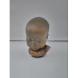 An antique chalk bronzed bust of a baby signed Eigendom G.F.U. [17CM IN HEIGHT]