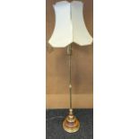 A Brass and wood floor standing lamp. [working]