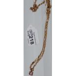 A 9ct gold rope style necklace with a 9ct gold and pink stone pendant. [13.47grams]