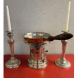 A Silver plated burner with copper can. Together with a pair of silver plate on copper candle