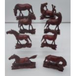 8 Chinese carved wooden horses.
