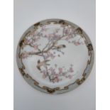 A Heavy Japanese hand painted bird and cherry blossom design plate. Eight Character signature to the