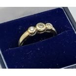 A 9ct gold ladies ring set with three diamonds [0.25ct] Ring size L. [2.77GRAMS]