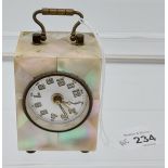 An Antique Mother of pearl cased travel clock.