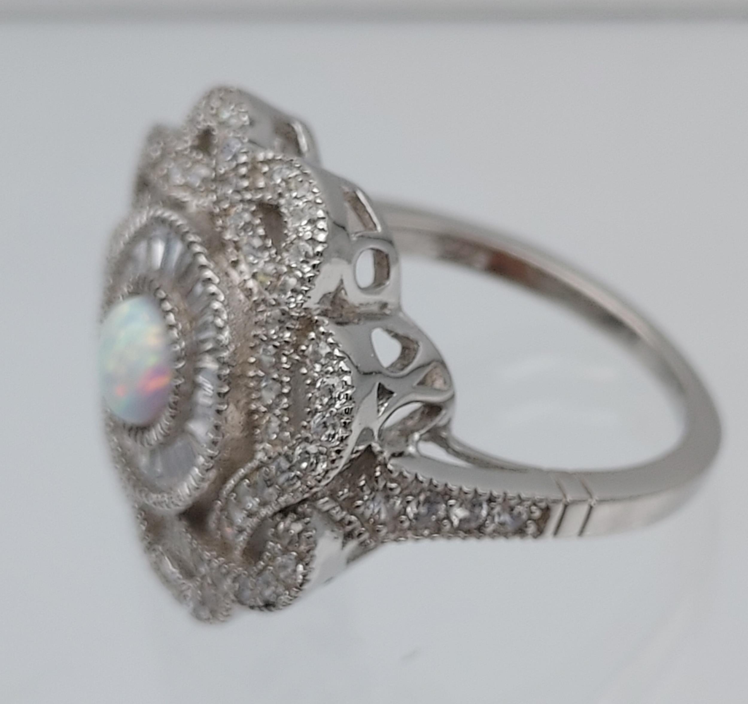 A silver CZ & opal paneled ring [7.12g] - Image 4 of 4