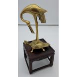 A Chinese Bronze/ Brass stork sat upon a Turtle. Comes with a pedestal stand. [28cm in height with