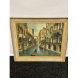 A Vintage oil painting on canvas depicting a Venice canal scene. Signed by the artist. [Frame
