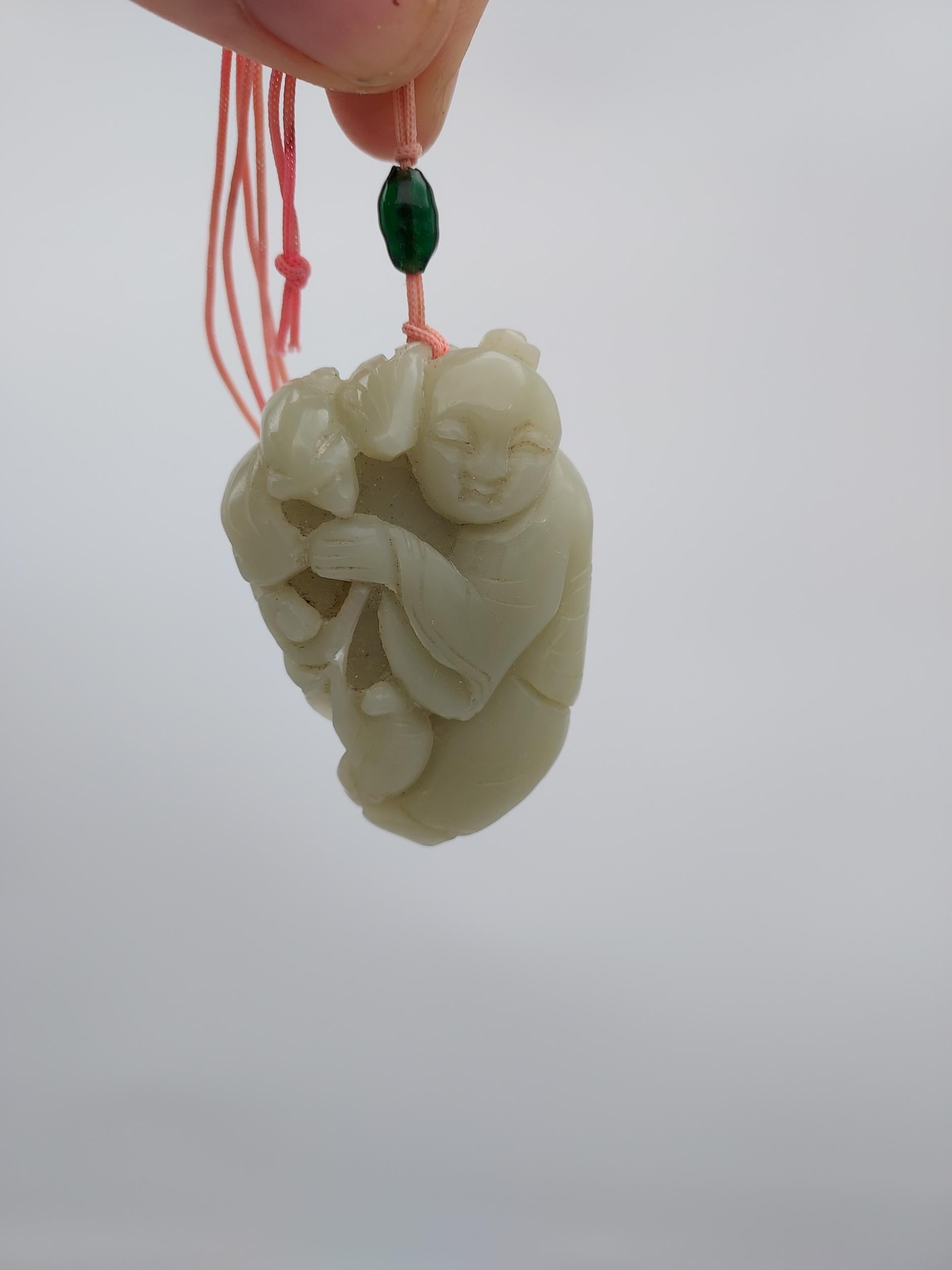 An early 20th century Chinese hand carved jade sculpture of a boy and bat. [6cm in length] - Image 6 of 6