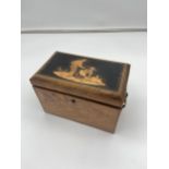 A 19th century two section foil lined tea caddy. Detailed with brass handle mounts and Farmer figure