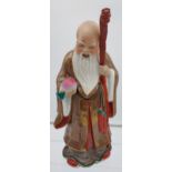 Antique Japanese hand painted god figurine with dragon head staff. Impressed mark to the base. [29cm