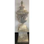 A Large Antique style garden urn sat upon a square base. [170x50x50cm]