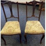 A Lot of two matching 19th century parlour chairs. Both designed with pierced splat backs and