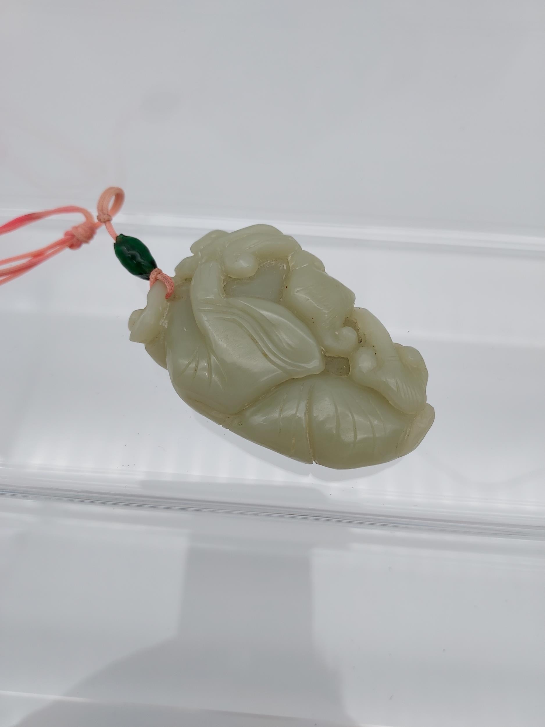 An early 20th century Chinese hand carved jade sculpture of a boy and bat. [6cm in length] - Image 4 of 6