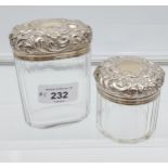 A Lot of two London silver topped dressing table preserve pots.