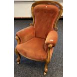 A 19th century button back parlour chair. Supported on carved legs and Reilly's Patent brass and