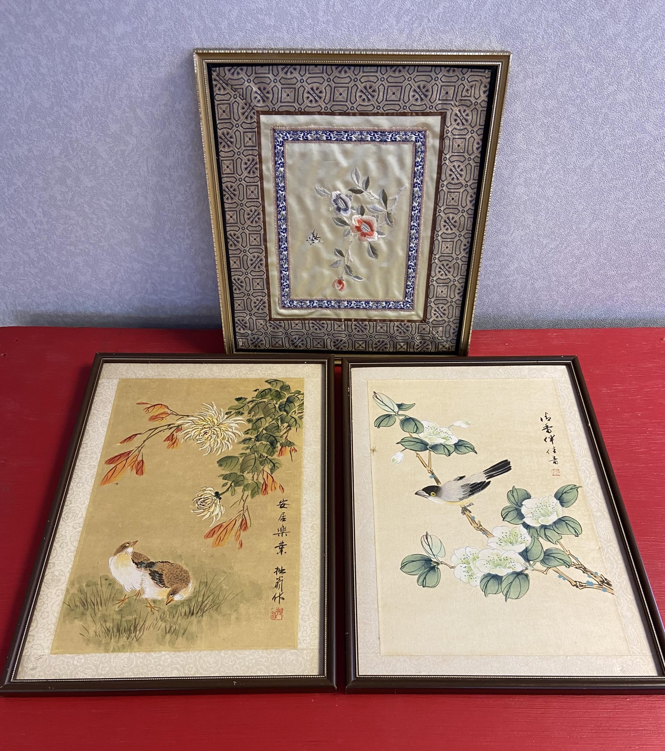 A Lot of three Chinese/ Japanese paintings on silk and tapestry.