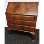 A Mahogany three drawer writing bureau. [100x75x45cm]