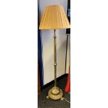 An Antique heavy brass rise and fall floor lamp. [Extends to 190cm] [In a working condition]