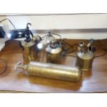 A Vintage brass fire extinguisher together with three vintage brass hand held burners converted into