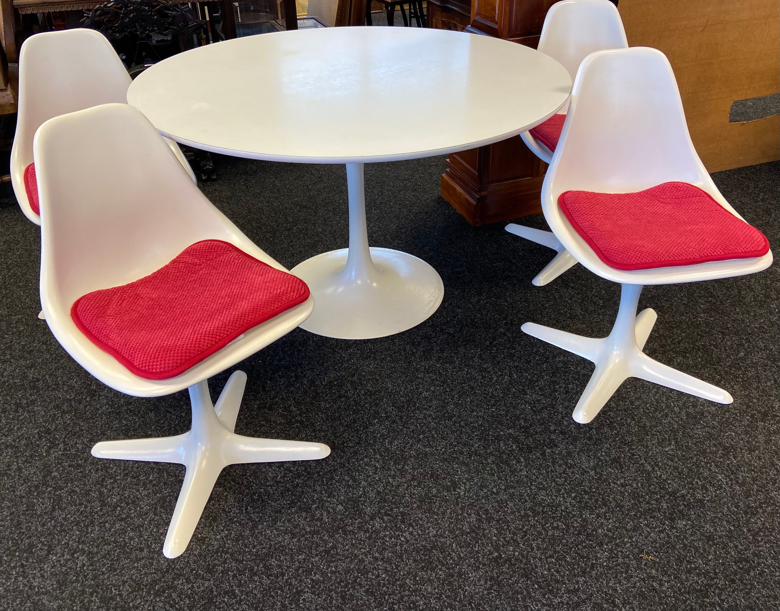 Tulip dining table with four swivel chairs by Maurice Burke for Arkana in early 1960's, Design