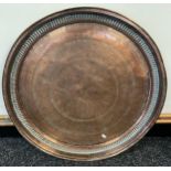 A 19th century engraved copper Indian table top. [68cm in diameter]