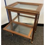 A Reproduction wood and glass section display case unit. Comes with a lift top serving tray and