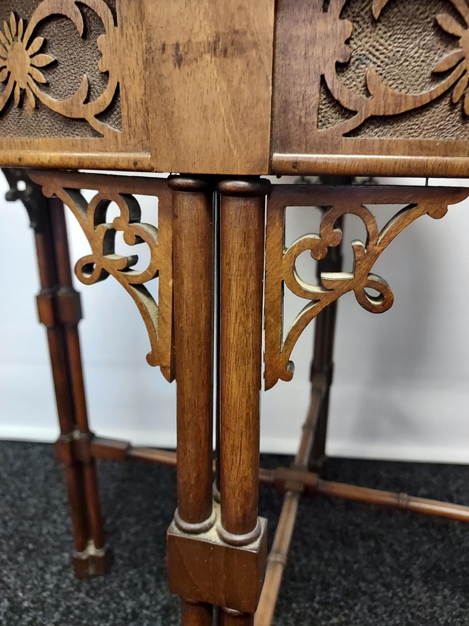 A 19th century barrel window table with glass top above a carved frieze, - Image 4 of 5